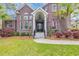 Elegant brick home with a covered front entrance and mature landscaping at 653 Whispering Pines Ct., Murrells Inlet, SC 29576