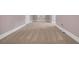 Finished hallway features neutral carpet and trim at 653 Whispering Pines Ct., Murrells Inlet, SC 29576