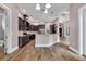 Modern kitchen with stainless steel appliances, dark cabinets, and open layout for entertaining at 653 Whispering Pines Ct., Murrells Inlet, SC 29576