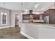Spacious open-concept kitchen with granite countertops, stainless steel appliances, and custom cabinetry at 653 Whispering Pines Ct., Murrells Inlet, SC 29576