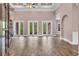 Spacious living room featuring tile floors, high ceilings and multiple doors to the back patio at 653 Whispering Pines Ct., Murrells Inlet, SC 29576