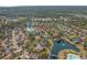 Aerial view of a lovely neighborhood featuring mature trees, ponds, landscaping, and well-maintained homes at 742 Camden Circle, Pawleys Island, SC 29585
