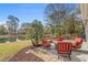 Charming backyard with patio seating, lush landscaping, and a view of the tranquil waterfront at 742 Camden Circle, Pawleys Island, SC 29585