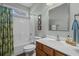 Bright bathroom featuring a tub and shower combination, vanity sink, and neutral wall color at 742 Camden Circle, Pawleys Island, SC 29585