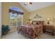 Vaulted bedroom featuring a large arched window, carpeted floor, and complementary furnishings at 742 Camden Circle, Pawleys Island, SC 29585