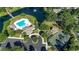 An aerial shot showcasing a community pool, tennis courts, and green spaces, offering residents diverse recreational options at 742 Camden Circle, Pawleys Island, SC 29585