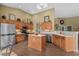Spacious kitchen with island, stainless steel appliances, and stylish cabinets at 742 Camden Circle, Pawleys Island, SC 29585