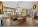 Spacious open-concept living area with wood floors and a view of the adjacent dining area at 742 Camden Circle, Pawleys Island, SC 29585