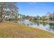 Expansive community pond featuring a water fountain and lush green surroundings in a tranquil setting at 742 Camden Circle, Pawleys Island, SC 29585