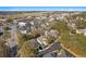Aerial view of a residential neighborhood near commercial and airport spaces, showcasing the surrounding area at 808 Arbor Ln., North Myrtle Beach, SC 29582