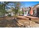 Backyard view featuring a patio area, sunroom addition, and storage shed at 808 Arbor Ln., North Myrtle Beach, SC 29582