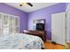Bedroom with hardwood floors, purple walls and white window shades at 808 Arbor Ln., North Myrtle Beach, SC 29582