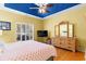 Well lit bedroom features hardwood floors, yellow walls, and a dresser with mirror at 808 Arbor Ln., North Myrtle Beach, SC 29582