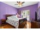 Bedroom with hardwood floors, window with shades, ceiling fan, and dark wood furniture at 808 Arbor Ln., North Myrtle Beach, SC 29582