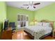 Well lit bedroom with hardwood floors, ceiling fan, and desk workspace at 808 Arbor Ln., North Myrtle Beach, SC 29582