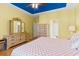 Spacious bedroom features hardwood floors, yellow walls, and walk-in closet access at 808 Arbor Ln., North Myrtle Beach, SC 29582