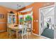 Charming dining area with hardwood floors, bright windows, and entry to sunroom at 808 Arbor Ln., North Myrtle Beach, SC 29582