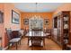 Elegant dining room featuring a large wooden table, decorative lighting, and classic furnishings at 808 Arbor Ln., North Myrtle Beach, SC 29582
