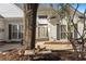 Inviting home entrance featuring a charming bench, stone pathway, and meticulously maintained landscaping at 808 Arbor Ln., North Myrtle Beach, SC 29582