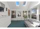 Sun room with vaulted ceilings, many windows, and patterned couch at 808 Arbor Ln., North Myrtle Beach, SC 29582