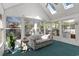 Bright sun room with vaulted ceiling, skylights, and multiple windows at 808 Arbor Ln., North Myrtle Beach, SC 29582