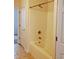 Neutral bathroom featuring tub/shower combination with a door leading to carpeted room at 836 Brookline Dr., Myrtle Beach, SC 29579