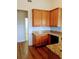 Spacious kitchen featuring wood cabinets, granite countertops and wood flooring at 836 Brookline Dr., Myrtle Beach, SC 29579
