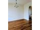 Open-concept living space features wood floors and an arched doorway at 836 Brookline Dr., Myrtle Beach, SC 29579