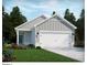 Charming single-Gathering home featuring a symmetrical facade, white trim, gray siding, and an attached two-car garage at 850 Cypress Preserve Circle, Longs, SC 29568