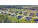 A residential neighborhood surrounded by lush greenery and winding water features at 124 Mesa Raven Dr., Longs, SC 29568