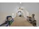 Large bonus room with ceiling fan, carpeting, and ample storage space at 124 Mesa Raven Dr., Longs, SC 29568