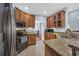 Kitchen showcasing ample cabinet space, granite countertops, and stainless steel appliances at 124 Mesa Raven Dr., Longs, SC 29568