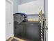 Functional laundry room with a washer, dryer, and storage cabinets for convenience at 124 Mesa Raven Dr., Longs, SC 29568