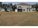 Expansive backyard featuring a covered patio and ample space for recreation at 1304 Winding Creek Way, Myrtle Beach, SC 29588