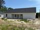 Back of house with white siding and covered porch under gray roof at 1395 Knotty Branch Rd., Conway, SC 29527