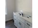 Bathroom vanity with white shaker cabinets, dark hardware, and white countertop at 1395 Knotty Branch Rd., Conway, SC 29527