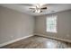 This bedroom features wood-look flooring, ceiling fan, and a window view at 1395 Knotty Branch Rd., Conway, SC 29527