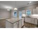 Open concept kitchen features a large island with granite countertops and stainless steel appliances at 1395 Knotty Branch Rd., Conway, SC 29527