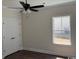 Neutral-colored bedroom with white double door closet, ceiling fan, and natural light at 1397 Knotty Branch Rd., Conway, SC 29527