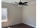 Neutral-colored bedroom featuring a ceiling fan, window, and wood floors at 1397 Knotty Branch Rd., Conway, SC 29527
