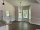 Dining room area featuring many windows providing natural light and wood floors at 1397 Knotty Branch Rd., Conway, SC 29527