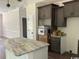 Kitchen area featuring grey cabinets, white marble countertops and stainless steel sink at 1397 Knotty Branch Rd., Conway, SC 29527