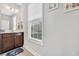 Bright bathroom with vanity, neutral walls, and a window at 1478 Suncrest Dr., Myrtle Beach, SC 29577