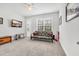 Comfortable bedroom with carpet flooring, ceiling fan, and ample natural light at 1478 Suncrest Dr., Myrtle Beach, SC 29577