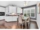 Bright dining area with white cabinets, hardwood floors, and a view of the backyard at 1478 Suncrest Dr., Myrtle Beach, SC 29577
