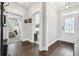 Hallway featuring hardwood floors, neutral paint, and access to bedroom and living spaces at 1478 Suncrest Dr., Myrtle Beach, SC 29577