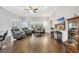 Spacious living room with hardwood floors, ceiling fan, and plush seating at 1478 Suncrest Dr., Myrtle Beach, SC 29577
