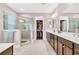 Elegant bathroom features a double vanity, glass shower, and walk-in closet at 1478 Suncrest Dr., Myrtle Beach, SC 29577