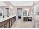 Well-appointed bathroom with double vanity, makeup table, and a large mirror at 1478 Suncrest Dr., Myrtle Beach, SC 29577