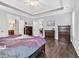 Bright main bedroom with hardwood floors and access to an ensuite bathroom at 1478 Suncrest Dr., Myrtle Beach, SC 29577